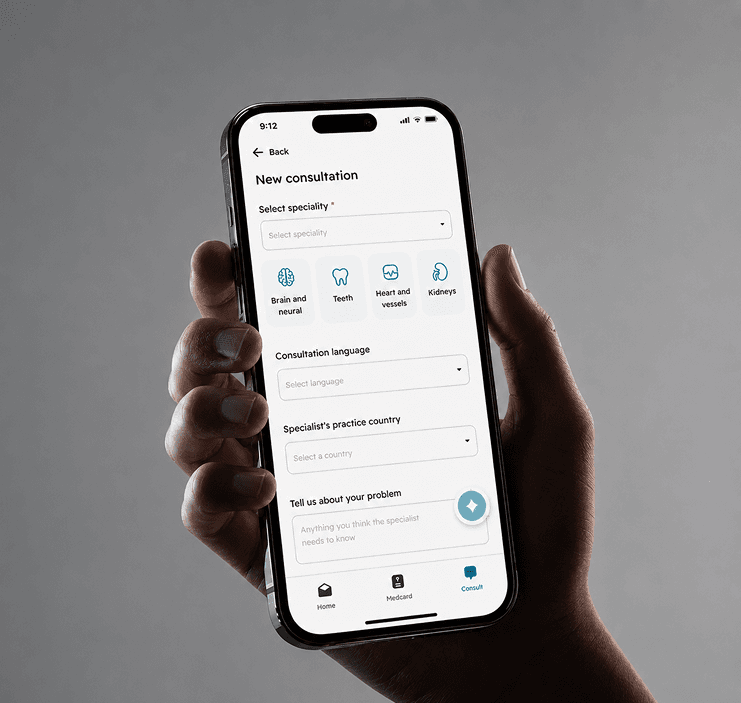 Telehealth platform hand holding phone - Select speciality and consultation language