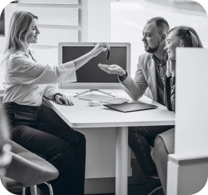 Customer operations team collaborating around a desk