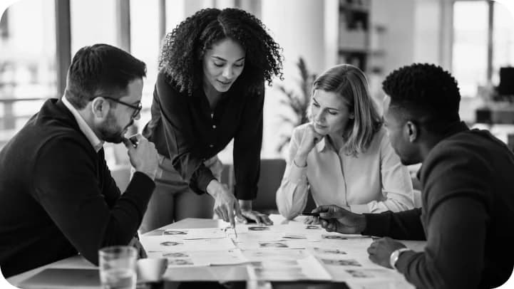 Recruiting team collaborating around candidate profiles